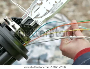 technicians-installing-optic-fiber-cable-600w-1039172032